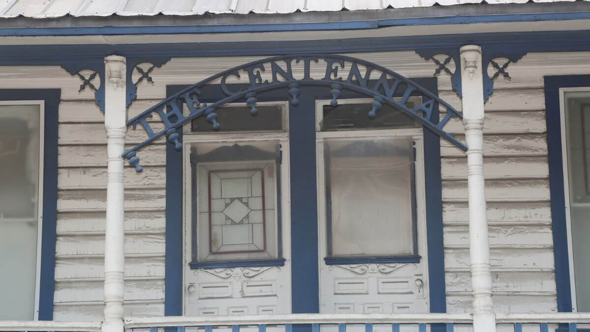 "The Centennial" sign on the Centennial House on Main Street.