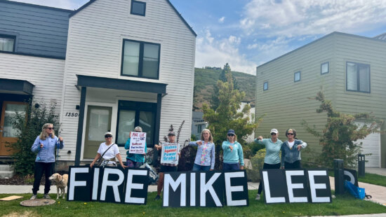 Protesters with Pro-Active Alliance hold signs outside the Park City Senior Center on Thursday, Sept. 4, 2025, during a visit from a staff member of Sen. Mike Lee’s office.