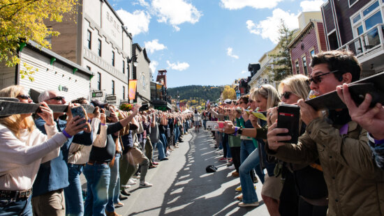 1,410 people line Park City's Main Street to take a shot and crown Park City the world record holder for Longest Shot ski on October 11, 2025.
