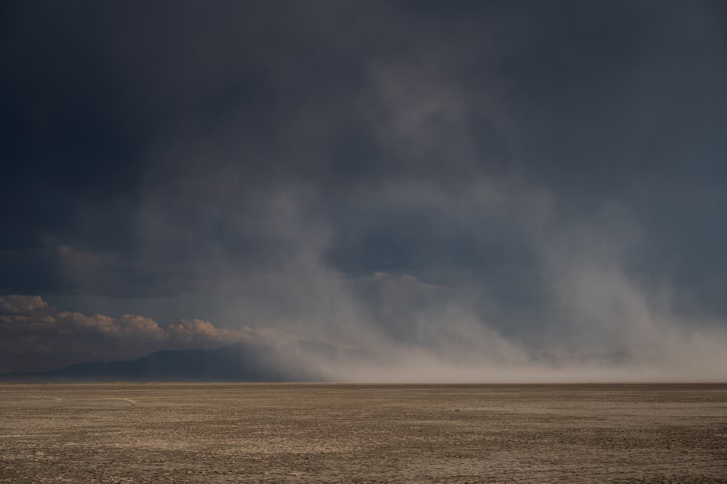Dust blows across Farmington Bay.