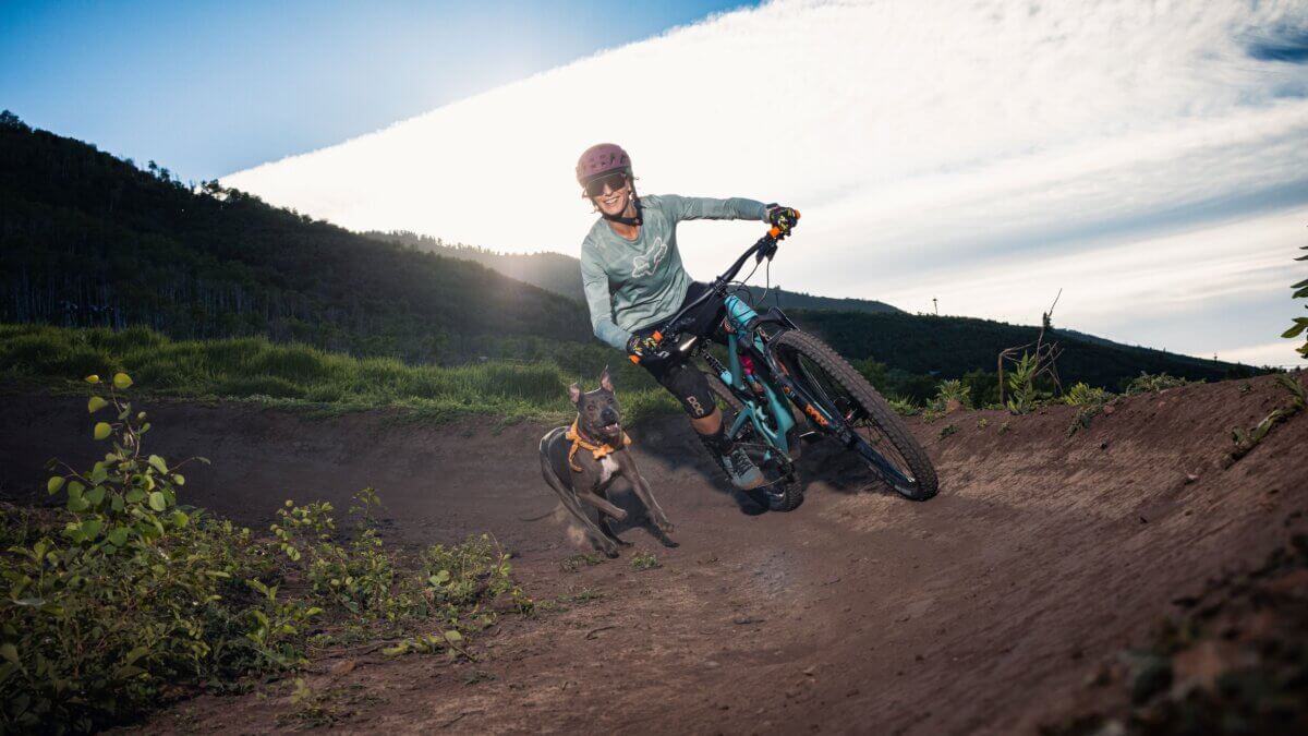 Miranda Lyle, owner of Play Strong Fitness, carves a trail in Park City. Lyle combines her passion for mountain biking with her expertise in strength coaching to help athletes build resilience, recover from injuries, and stay strong to play strong.