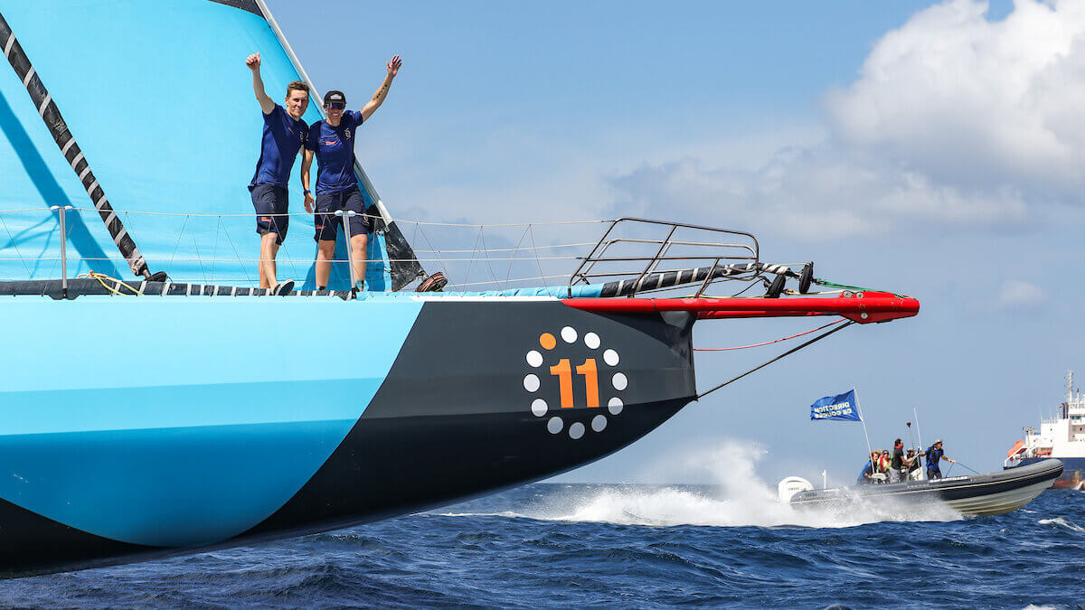Skippers Will Harris and Francesca Clapcich celebrate aboard 11th Hour Racing after finishing second in the Transat Café L’OR on Friday in Fort-de-France, Martinique. The duo’s podium finish marked the best IMOCA result for a non-French team since 2011 and the highest finish by a woman in the class in two decades.