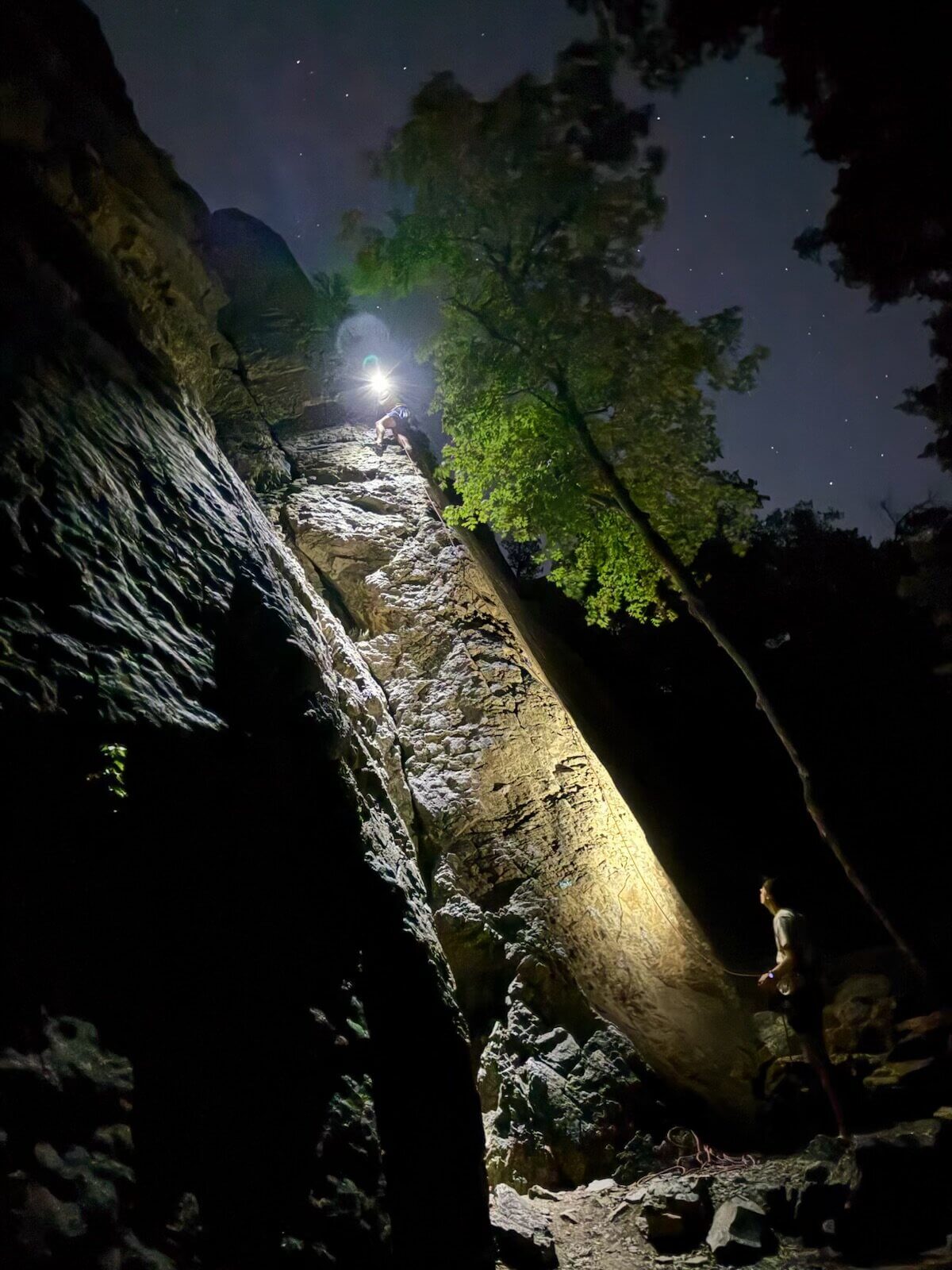 Emmett Olson belaying Root Roepke in Wasatch Mountains.