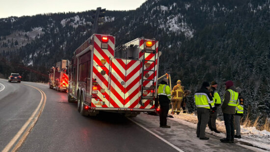 Officials on the sene in Little Cottonwood Canyon Tuesday morning after a fatal rollover crash.