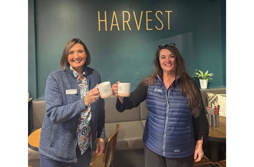 Park City Chamber representatives raise Mountainkind mugs at Harvest during the second annual Mountainkind Morning event.