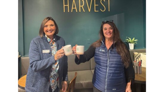 Park City Chamber representatives raise Mountainkind mugs at Harvest during the second annual Mountainkind Morning event.