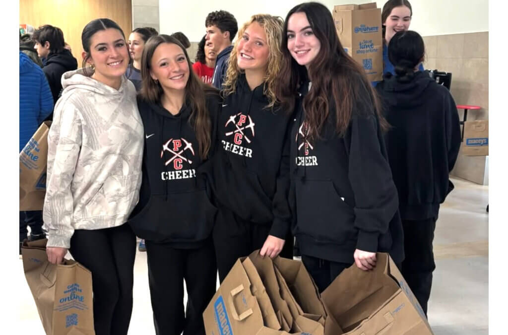 Park City High School cheerleaders help pack meal boxes as volunteers assemble about 1,000 holiday meals for families in Summit and Wasatch counties on Dec. 20.