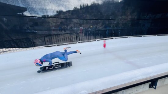 Skeleton slider jumping on after crossing the red starting line at the Utah Olympic Park during the Olympic qualifying race attended by 25 countries.