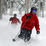 People ski between the trees in the deep powder at Telluride Ski Resort, March 10, 2006.