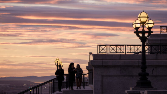 People walk on the south steps of the Capitol in Salt Lake City before a special session of the legislature on Tuesday, Dec. 9, 2025.