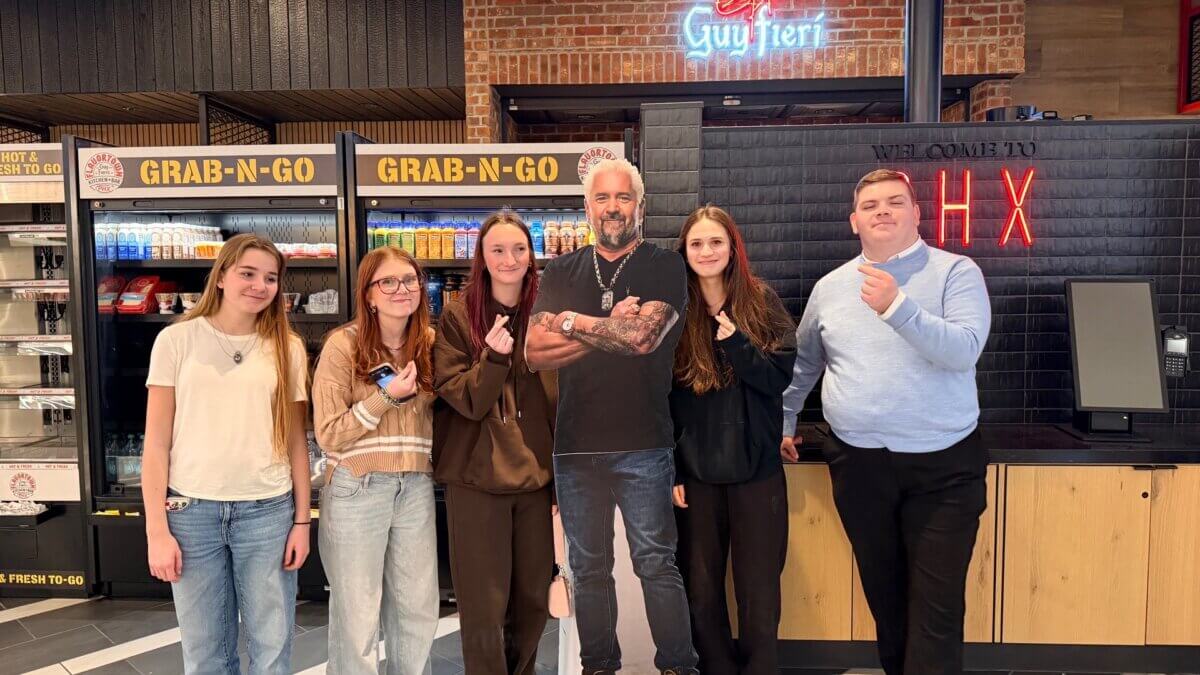 It's undebatable that Debate Team travel flight delays bring out the silly side of these otherwise serious Miners posing with a cardboard celebrity cutout.