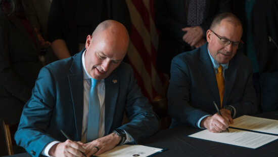 Utah Gov. Spencer Cox and U.S. Forest Service Chief Tom Schultz sign an agreement giving Utah a greater role in managing national forest land, at the Utah Capitol on Jan. 8, 2026.