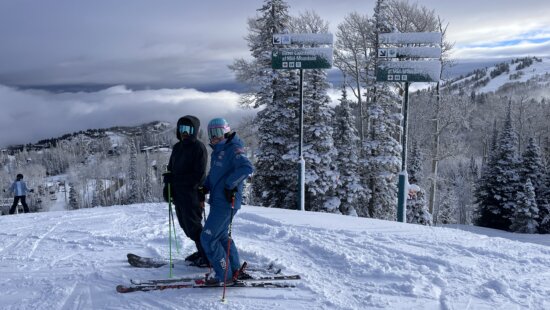 Park City's Katie Hensien in her blue Stifel US Ski Team with Back-to-Snow-Coach Ian Garner at Deer Valley Resort.