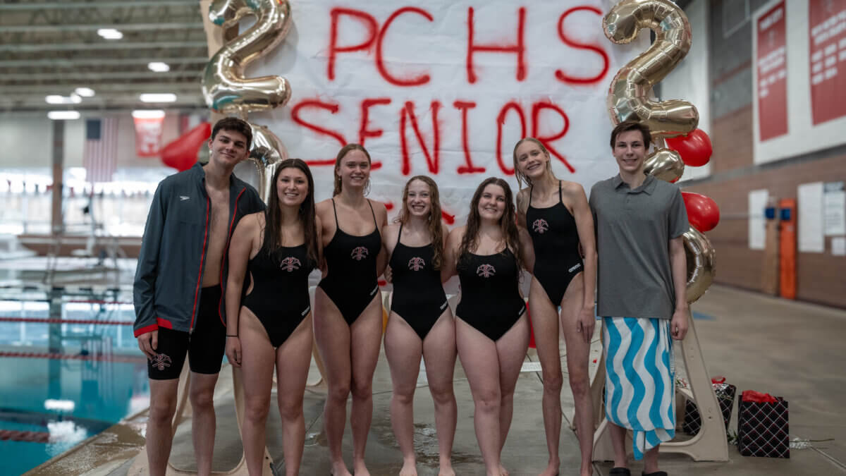 Park City High School swim team seniors, from left, Dmitriy Siminovskiy, Taylor Bergman, Anna Klug, Ruby Neath, Kathryn Schofield, Aisling Taylor and Kyler Collier pose during senior night on Jan. 22. The Miners defeated Judge Memorial as both teams prepare for the Region X Championships on Jan. 31.