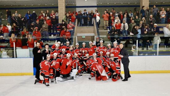 Park City High School Miners Varsity Red Boys Team holding the trophy minutes after winning 7-1 at the Utah High School State Championships in Salt Lake City on Wednesday.