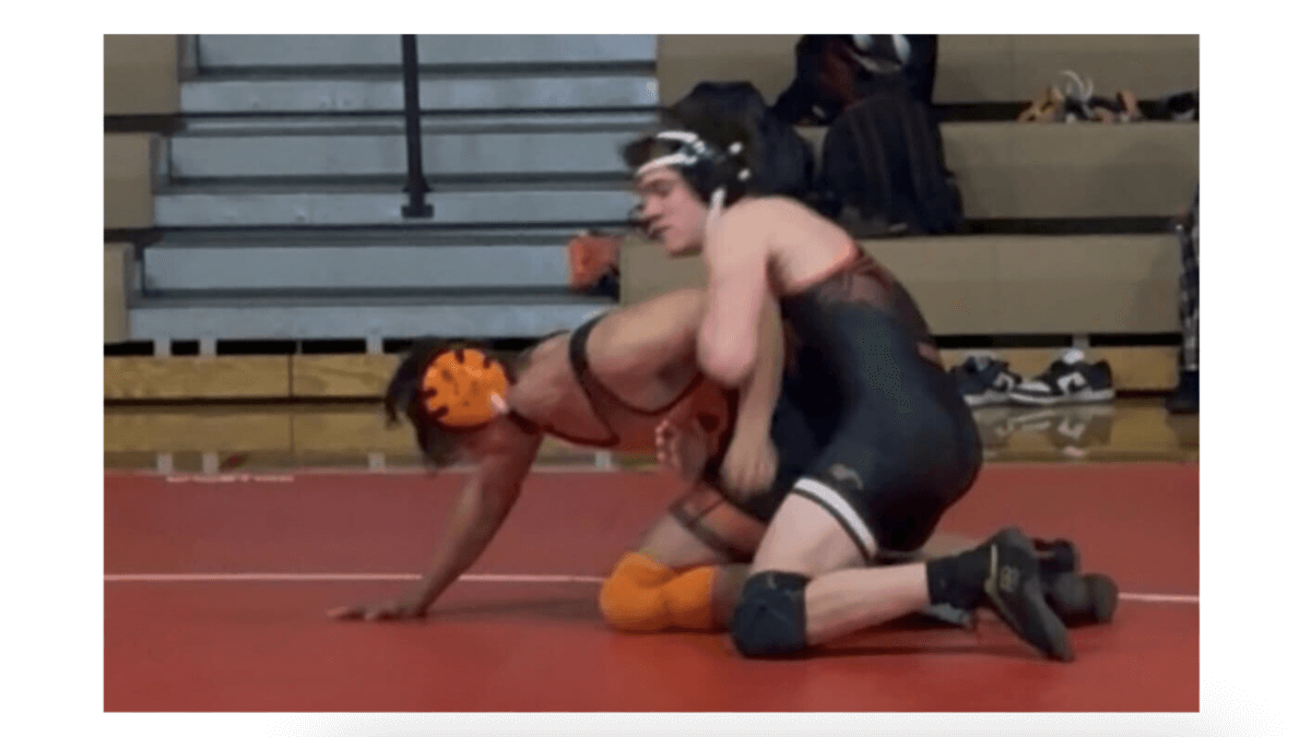 Senior wrestler for Park City High School Miners, Jackson Richey, competing in the category of 150 lbs.
