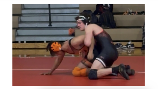 Senior wrestler for Park City High School Miners, Jackson Richey, competing in the category of 150 lbs.
