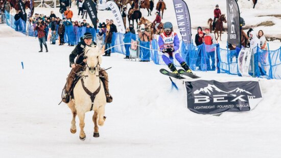 Skijoring involved skiers pulled by a teammate on horseback through a snowy obstacle course.