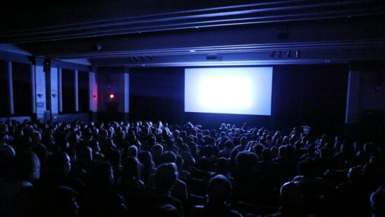 Audience atmosphere before the premiere of 'Didn't Die' at the Library Center Theatre.