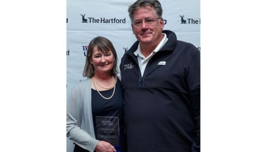 Nancy Gustafson is inducted into the National Adaptive Sports Hall of Fame in the Winter Competitor Category by Move United CEO Glenn Merry.