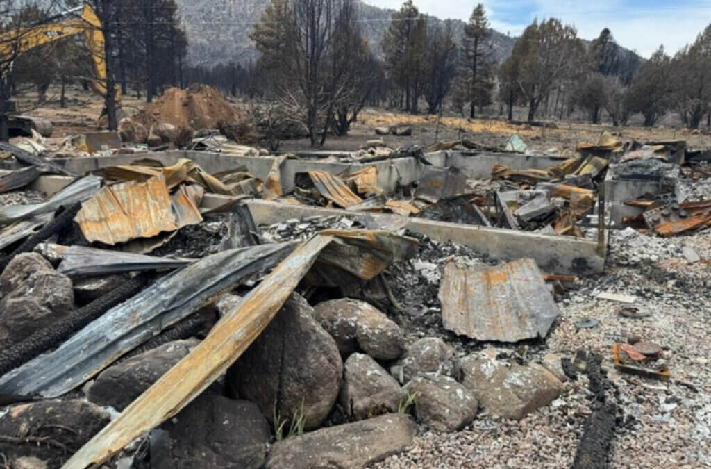 Debris from a burned structure is seen in the Pine Valley area after the Forsyth Fire in 2025. Utah State University Extension says the lightning-caused fire underscored the risks of living in the wildland-urban interface and the value of Firewise preparation.