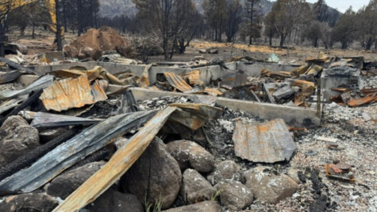 Debris from a burned structure is seen in the Pine Valley area after the Forsyth Fire in 2025. Utah State University Extension says the lightning-caused fire underscored the risks of living in the wildland-urban interface and the value of Firewise preparation.