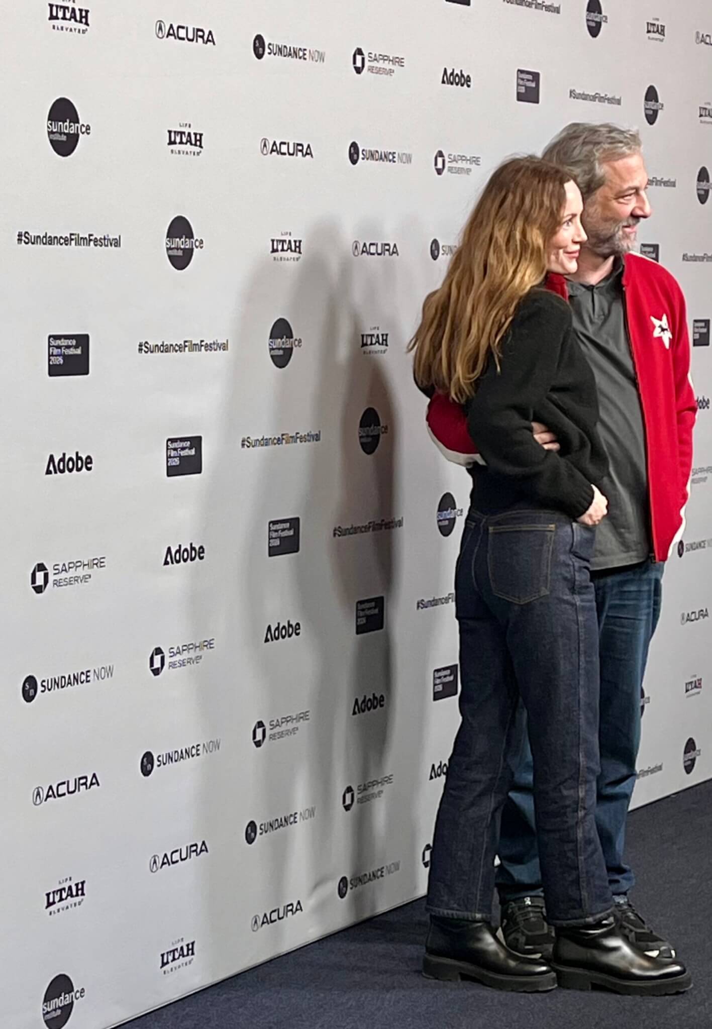 Judd Apatow with wife Lesley Mann (just off camera is their daughter, Maude)