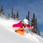 A skier carves through fresh powder at Deer Valley Resort.