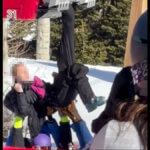Park City Mountain employees support a woman after her ski boot became trapped in the doors of a Red Pine Gondola cabin, leaving her hanging upside down near the Canyons Village loading area on New Year’s Eve.