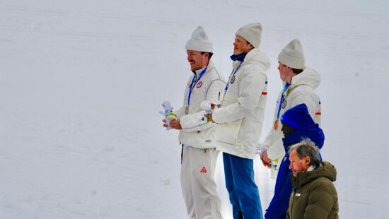 Ben Ogden (in front) of Team USA, with his Milano Cortina Olympic Cross Country gold medal