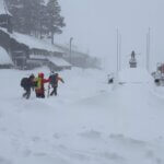 Search and rescue crews head into whiteout conditions near Castle Peak in Truckee, Calif., on Tuesday, Feb. 17
