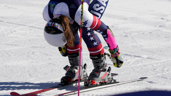 United States' Paula Moltzan unlatches her boots at the finish area of an alpine ski, women's giant slalom race, at the 2026 Winter Olympics, in Cortina d'Ampezzo, Italy, Sunday, Feb. 15, 2026.