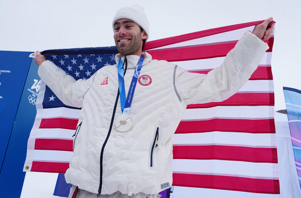 Silver medalist United States' Alex Hall holds an American flag after the men's freestyle skiing slopestyle finals at the 2026 Winter Olympics, in Livigno, Italy, Tuesday, Feb. 10, 2026.