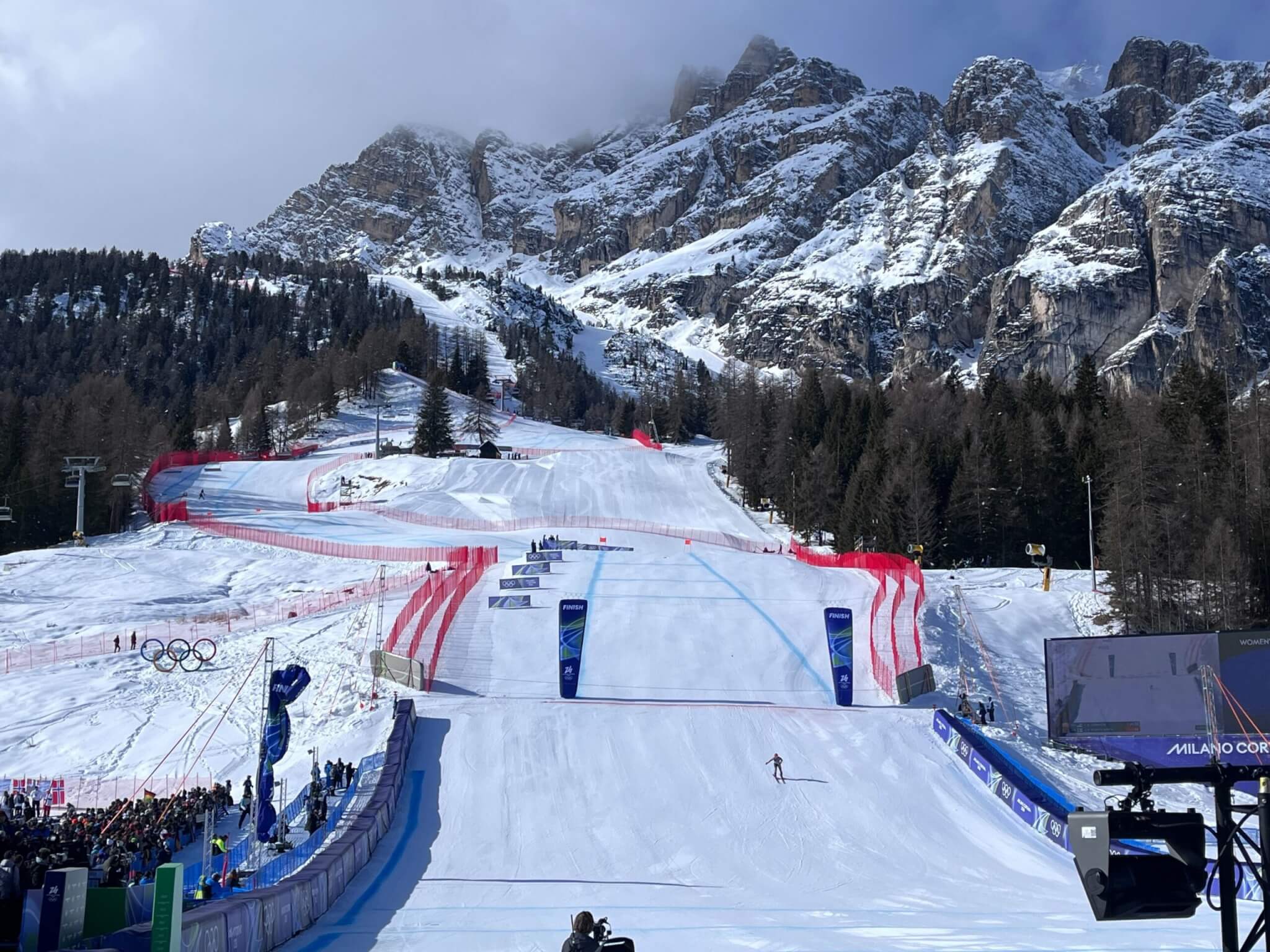 A skier crosses the finish line in the women's downhill at the Olimpia delle Tofane course during the Milano Cortina 2026 Winter Olympics in Cortina d'Ampezzo, Italy