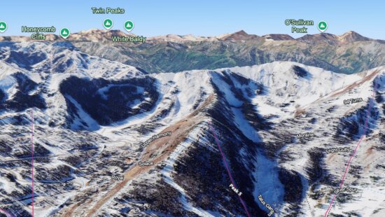 Peak 5 lift at Canyons Village with the Park City ridgeline behind it.