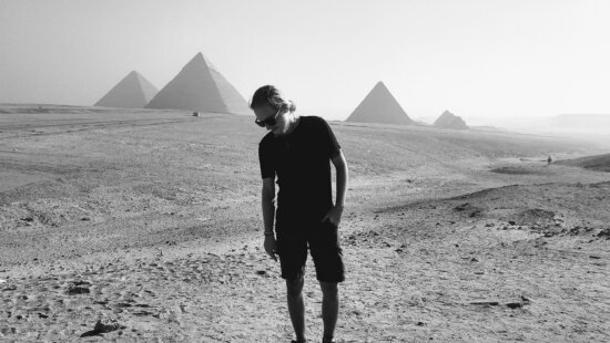 Owen Weinman stands near the pyramids at Giza in Egypt — a trip he says helped spark the Egyptian-rooted name and origin story behind his online spagyric herbal tincture business, Zep Tepi Solutions.