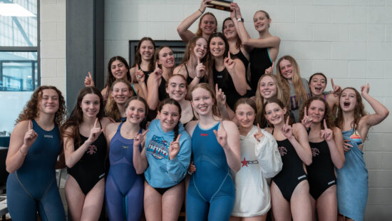 The Park City High School girls swim team celebrates after capturing the Region 10 championship at the Wasatch Aquatics Center in Heber City on Jan. 31.