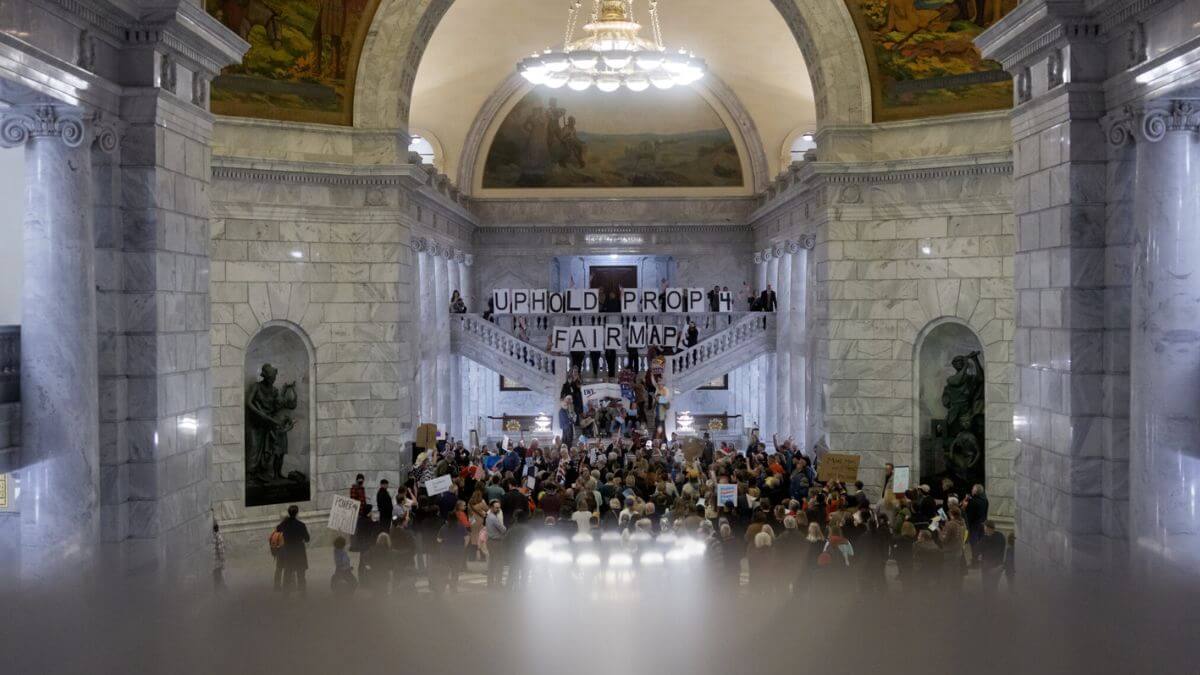 People protest the legislature’s efforts to undo the state’s new congressional maps before a special session of the legislature at the Capitol in Salt Lake City on Tuesday, Dec. 9, 2025.