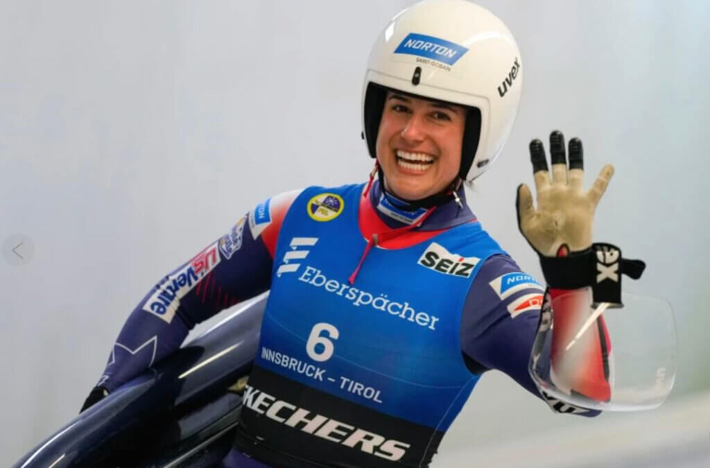 Emily Sweeney of the United States waves after the women's sprint race at the Luge World Cup in Igls near Innsbruck Austria on Saturday, December 7th 2024 (AP Photo/Matthias Schrader, File)