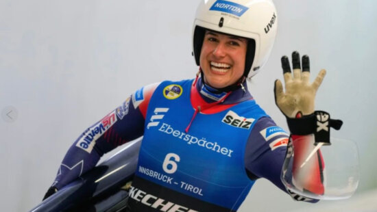 Emily Sweeney of the United States waves after the women's sprint race at the Luge World Cup in Igls near Innsbruck Austria on Saturday, December 7th 2024 (AP Photo/Matthias Schrader, File)