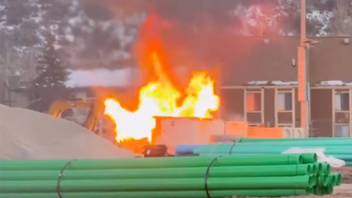 Flames engulf a trailer at a construction site near Dozier Field at Park City High School on Tuesday evening. No injuries were reported and school operations were not affected.