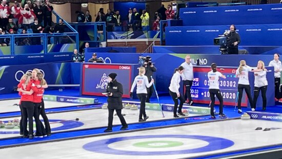 Canada celebrating as USA exits the Curling Sheet.