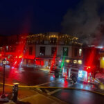 Park City Fire District trucks line Main Street Thursday night as smoke rises from the roof of Chimayo restaurant.