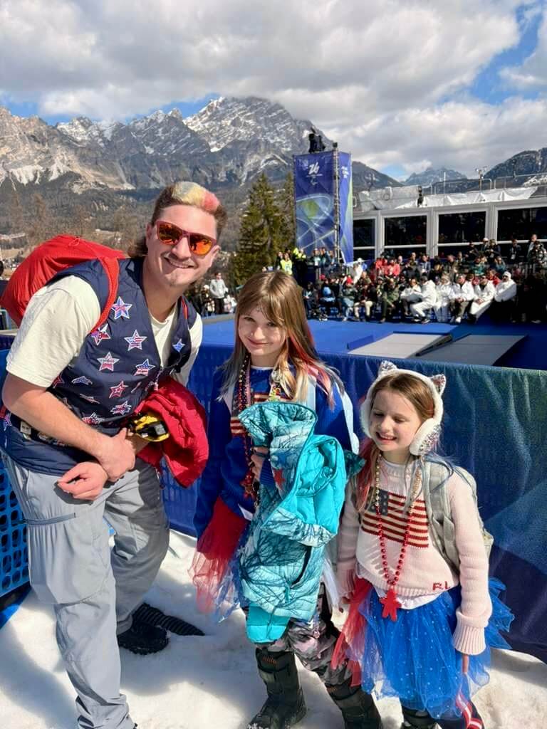 Brenna Huckaby's Husband and daughters watching her Medals Ceremony.