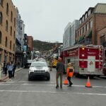 Park City Fire District units and road cones block access to Main Street Saturday as police evacuate the area following a bomb threat at the Egyptian Theatre.