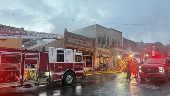 Park City Fire District trucks line Main Street Thursday night as smoke rises from the roof of Chimayo restaurant.