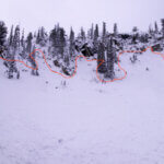 Photo of the terrain where the slide occurred. The victim entered from the left side of the photo, traversing into the bowl. he red line depicts the crown of the avalanche.