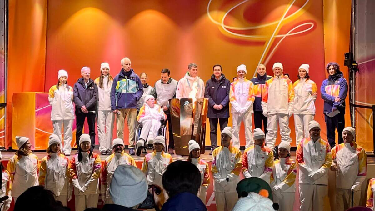 President of the International Paralympic Committee (IPC) Andrew Parsons (third from the right and wearing white) in Cortina during a regional Paralympic Torch Run Ceremony. Photo: TownLift // Michele Roepke