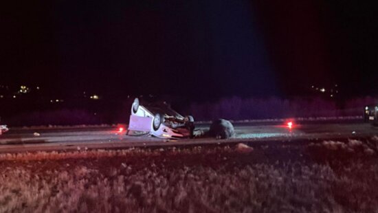 A vehicle rolled over on I-80 after a cow-vehicle collision.