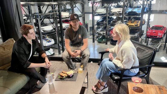 Warehouse founder Jake Wolf with Membership Director Karen Lynch to his right, and Operations Director Luke Larson to his left, inside their business.